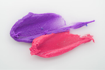 Colored cosmetic creamy skin care lotion texture. A smear of paint. Hair conditioner, smear on a colored background. Cream cosmetic product close up. Shampoo, balm. Ointment. Pomade.