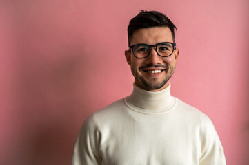 Man in glasses, white turtleneck sweater with smile and beard