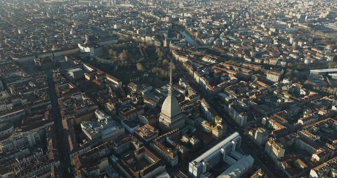 Aerial view of the Mole Antonelliana tower, a landmark building in Turin downtown at sunset, Turin, Piedmont, Italy.
