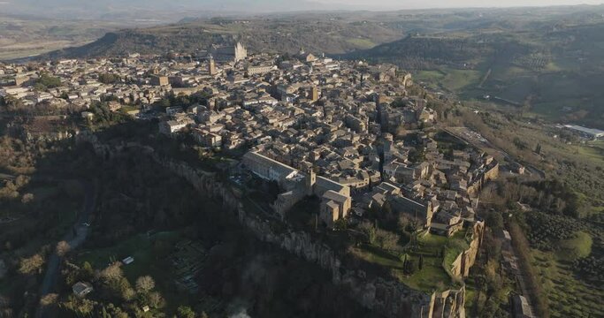 Aerial view of Orvieto at sunset, a small town perched on the rock cliff in Umbria, Terni, Italy.