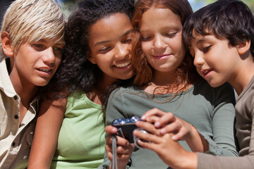 Children, friends and check camera with picture for social media, photography and scroll for...