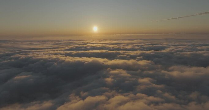 Aerial view of a beautiful sunset as seen from the plane, view above the clouds, Amalfi Coast, Salerno, Campania, Italy.
