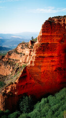 Nature area with orange-colored clay rock formations
Las Medúlas Natural Park in Spain
