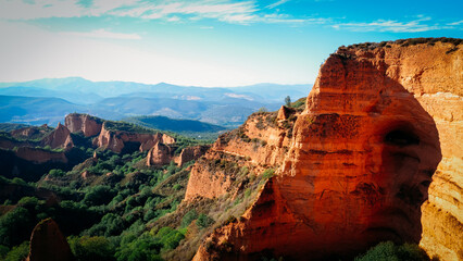 Nature area with orange-colored clay rock formations
Las Medúlas Natural Park in Spain