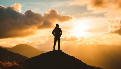 silhouette of a person on the top of mountain