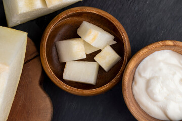 yogurt with melon flavor and ripe and delicious melon close-up