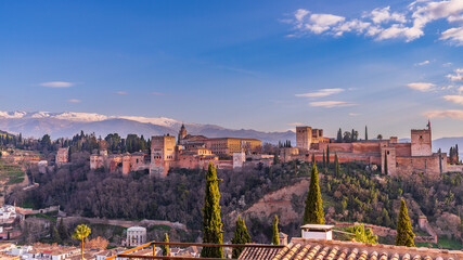 View of the Alhambra in Granada at sunset from the Mirador de San Nicolas, in Andalucia, Spain. - obrazy, fototapety, plakaty