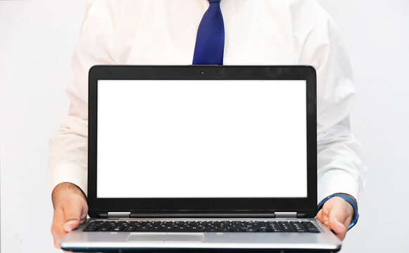 Man Holding Laptop with White Empty Screen as Placeholder, background. Technology concept with smart laptop in the hands