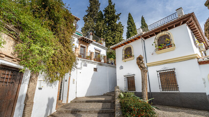 Fototapeta na wymiar Street in the popular neighborhood of Albaicin in the city of Granada, in Andalusia, Spain