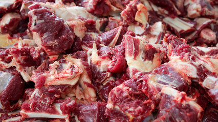 Piles of cow and lamb meat from halal slaughtering during Eid Al-Adha. The Feast of Sacrifice or...