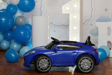 Blue baby car on balloons background