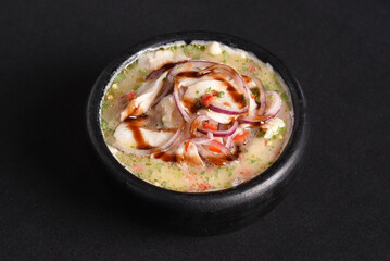 ceviche raw fish food with lemon onion pepper and lemon, healthy food