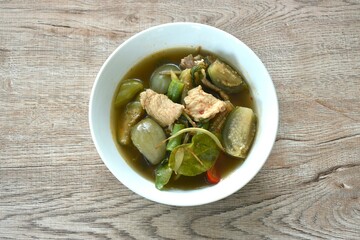 hot and spicy wild boar with variety vegetable and Thai herbs soup on bowl  