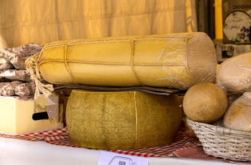 Heads of different types of cheese on the market.