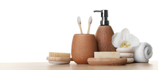 Bath accessories. Different personal care products and flower on wooden table against white background. Space for text