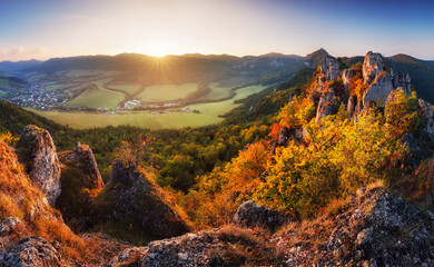 Scenic view of autumn mountain landscape with foggy valley. The Sulov Rocks, national nature...