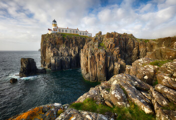 Isle of Skye lighthouse at Neist Point with beautiful golden light, beautiful landscape with sea - Scotland - 741479964