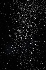 A serene image of snow falling in black and white, perfect for winter themes