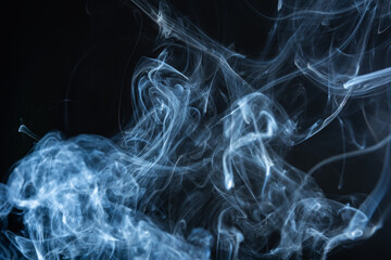 Against the backdrop of night, fascinating smoke formations rise, arranging themselves into...