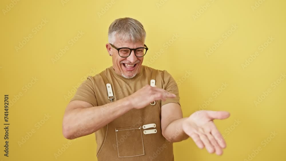 Sticker middle age grey-haired man wearing apron and glasses standing doing money gesture with hands, asking