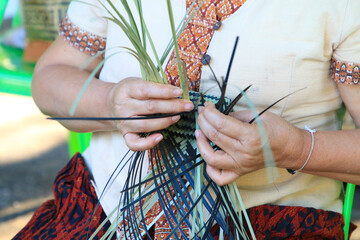 A Thai woman´s hand is weaving an ancestral basket case from bamboo. People are demonstrating weavinga traditional basket made from bamboo. UNESCO Intangible Cultural Heritage of Humanity