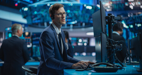 Portrait of Adult Caucasian Man Working in an International Stock Exchange Company: Specialist Monitoring Equity and Share Markets, Communicating with Clients, Working with Corporate Business Partners