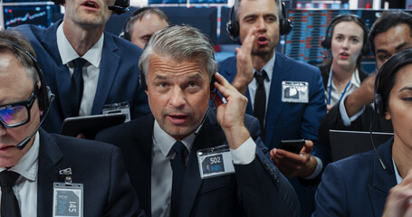 Portrait of Professional Traders Working on a Stock Exchange. Enthusiastic Men and Women Shouting,...