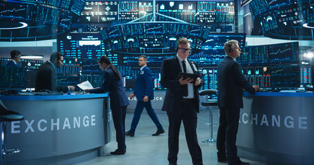 Routine Work Day in an International Stock Exchange Hall: Group of Multiethnic Specialists Monitoring Equity and Share Markets, Working on Maximizing Profits for Corporate Business Partners
