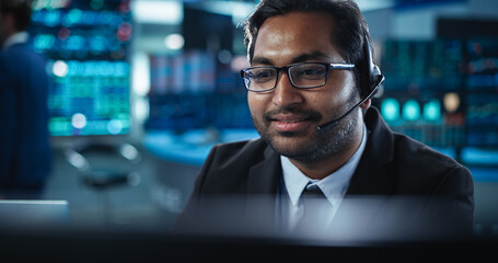 Portrait of a Young Indian Man Working in an International Stock Exchange Company: Happy Trader...