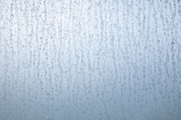 Dried hard water stains on shower window, close up shot, no people