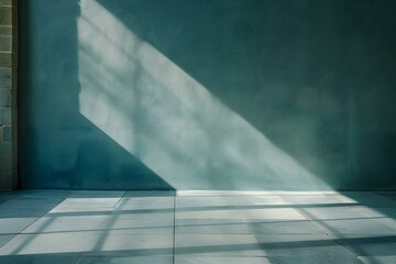 Minimalist dusty blue wall in empty room with sun shadow backdrop. Concept Minimalist Decor, Dusty Blue Wall, Sun Shadow, Empty Room