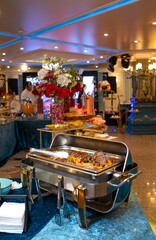 Close-up of a marmite buffet with a delicious beef dish inside