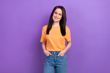 Portrait of adorable lovely girl with stylish hairdo wear oversize t-shirt holding arms in pockets isolated on violet color background