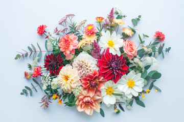 Artistic arrangement of flowers and foliage, creating a beautiful flat lay with plenty of copyspace.
