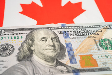 US dollar banknotes on Canada flag background, Business and finance.