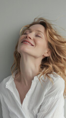 Fototapeta premium Happy attractive confident young adult or mid aged European woman posing for beauty aesthetic portrait. Beautiful lady smiling on background, attractive female model looking at camera. Close up face .