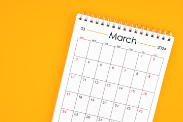 March 2024 desk calendar on yellow color background, position with copy space.