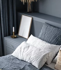 Fototapeten Frame mockup in cozy dark blue bedroom interior, 3d render © artjafara