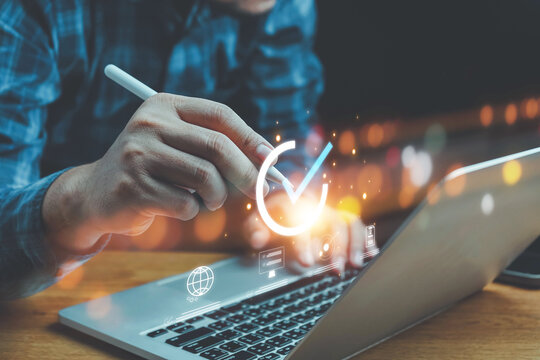 ISO standards quality control, Customer Satisfaction Guarantee concept on virtual screens, Standardization, Businessman using laptop computer with quality assurance and document icon for ISO.