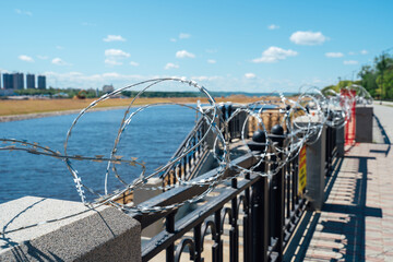 Fence with barbed wire. No entry. The border is guarded