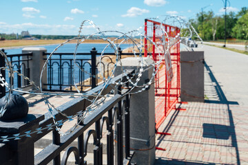 Fence with barbed wire. No entry. The border is guarded
