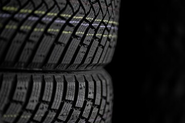 Close-up of rubber tires for the summer or winter season of different thicknesses and diameters on...