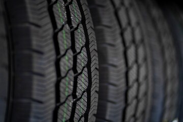 Close-up of rubber tires for the summer or winter season of different thicknesses and diameters on...