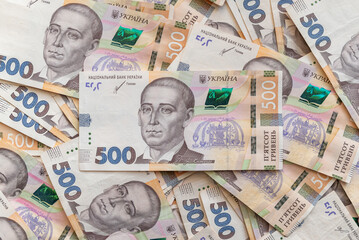 500 hryvnia banknotes covering the surface, close up. Money in Ukraine, richness, good earnings,...