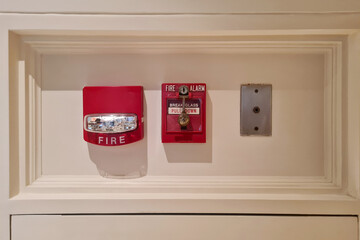 fire alarm box on a wooden wall for warning and security systems in public spaces