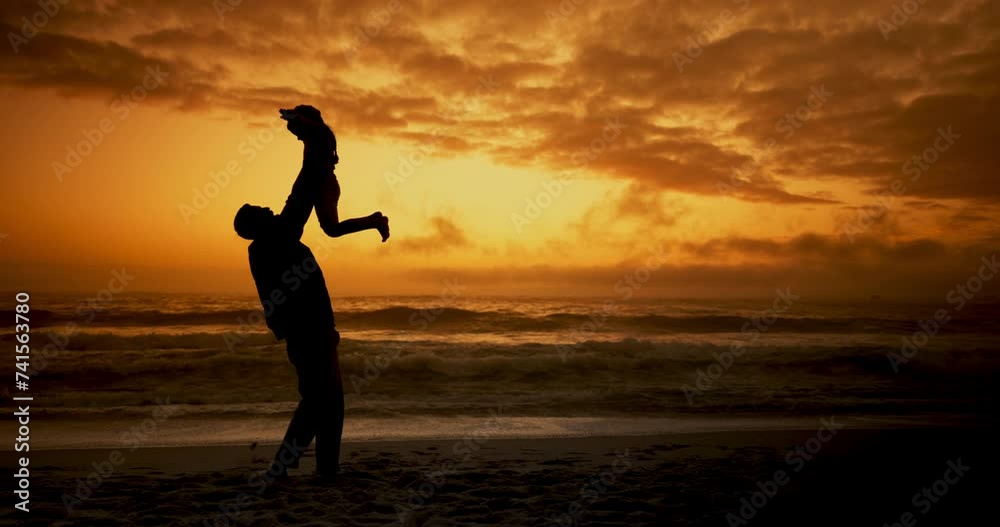 Wall mural Father, child and lift in beach with silhouette, sunset and care with games with clouds in nature on holiday. Person, kid and bonding with love, waves and family at dusk for outdoor vacation with sky