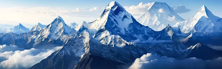 Crédence de cuisine en verre imprimé Everest A majestic winter scene in Rocky Mountain National Park, where snow capped mountains rise against the crisp blue sky, offering breathtaking views.