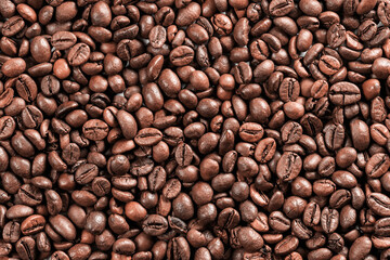 Background from coffee grains. Roasted coffee for breakfast. Morning awakening