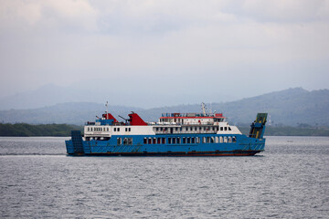 Ferries sail on the sea, ferries in the Bali Strait as a means of transportation between islands in...