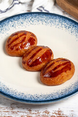 Sekerpare or badempare dessert on a white wood background. Traditional Turkish cuisine flavors. ramadan dessert